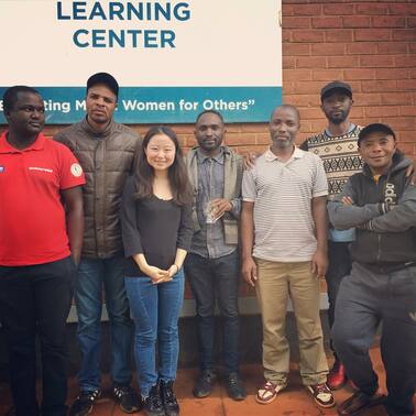 Konexio Co-founder and CEO Jean Guo with potential new Konexio recruits at the Dzaleka Refugee Camp // Lilongwe, Malawi